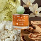 Perfume capilar Click Hair de miel y pistacho 100 ml, frasco dorado con tapa verde sobre pistachos